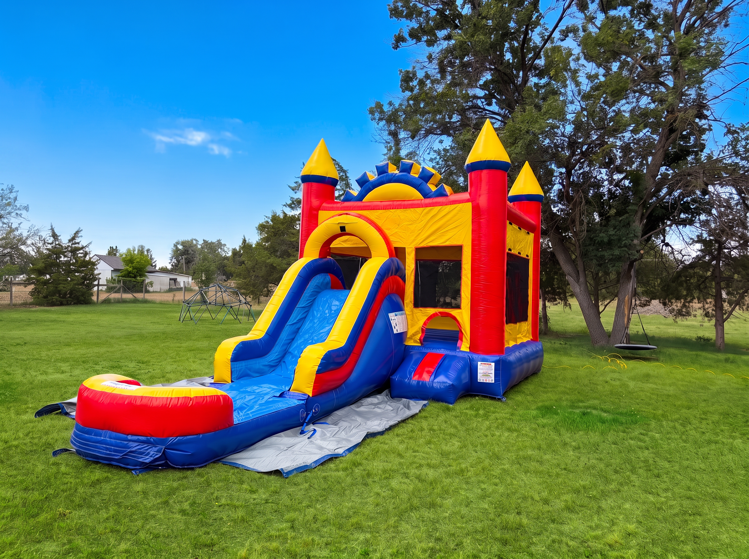 Front slide water combo bounce house set up in a sunny backyard